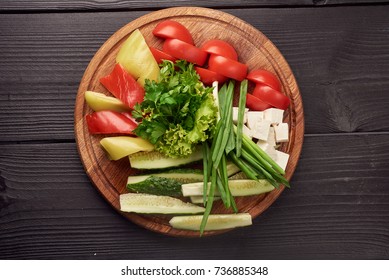 Platter Of Fresh Vegetables And Cheese On Round Board. Top View