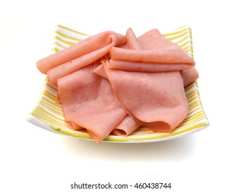 A Platter Of Thin Sliced Honey Ham On White