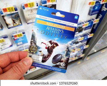 PLATTSBURGH, USA - JANUARY 21, 2019 : Season Pass Card Of Assassins Creed Odyssey Video Game In A Hand Of A Buyer At Walmart Store.