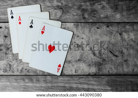 Play Casino Cards Games on the Rough Grunge Texture of Real Wood Vintage Table  Black and White Color Background Copy Space on The Right / Top of the World ,Gang of Four ( 4 ) , Team Work