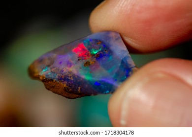 The play of color in Australian precious boulder opal. - Shutterstock ID 1718304178