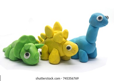 Play Dough Dinosaur On White Background. Handmade Clay Plasticine