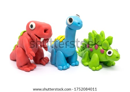 Play dough group Tyrannosaurus, Brachiosaurus, Stegosaurus, on white background. Handmade clay plasticine