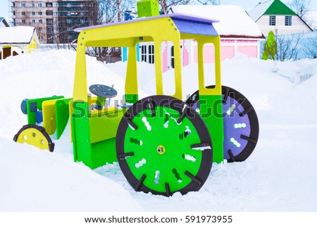 Play houses and machine plywood on a street Playground in the winter in the snow