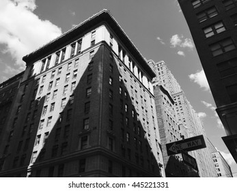 The play of light and shadow on a building on New York City building in midtown - dark shadow. Photo can be used to display uniqueness, being different, opposites, light and darkness, architecture.