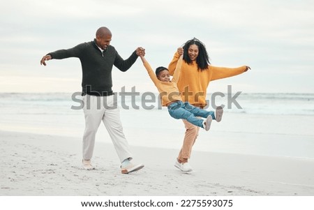 Play, mother and father with child on beach enjoy holiday, travel vacation and weekend together. Happy family, parents and dad, mom and kid holding hands for bonding, quality time and swinging by sea