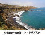 Playa de el Bollullo black volcanic sand beach in Tenerife, Canary Islands, Spain