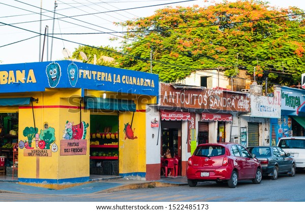 Playa del Carmen, Mexico - 22 August 2019\
Corner street colorful Fruits and Vegetables store.\
Translation:\