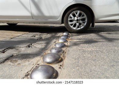 Playa Del Carmen, Quintana Roo, Mexico - January 31.2022 Rigid Metal Speed Limiter. The Car Overcomes The Speed Bump.