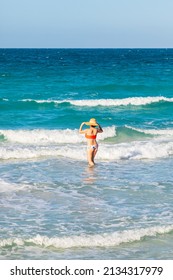 Playa El Tecolote, La Paz, Baja California Sur, Mexico. November 11, 2021. Woman In The Surf Near La Paz.