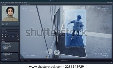 Playback CCTV camera on computer screen. Outside security camera of business office. AI program with facial recognition and personal profiles. Face scanning system. Digital surveillance and tracking.