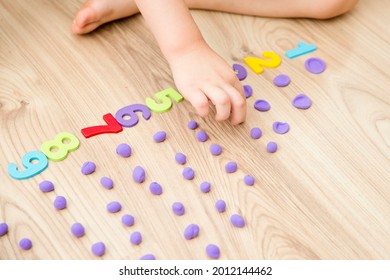 Play-Doh Stones And Numbers. Counting DIY Game. Mathematical Task. Play At Home. Way Of Learning. Kid Flatten Balls When Saying A Digit.