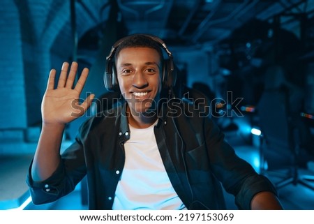 The player is greeted on the web camera before the start of the tournament. High quality photo