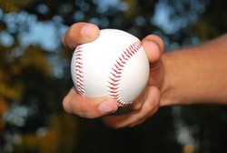 Player Gripping A New Baseball And Throws The Ball On Defense