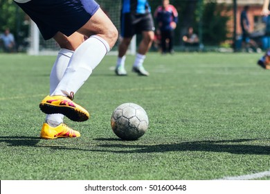 A Player Hits The Ball On The Artificial Turf. Football / Soccer. 