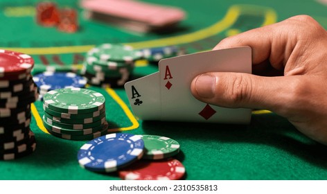 Player peeking cards in Blackjack game - Powered by Shutterstock