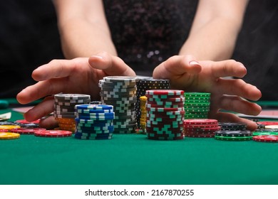 A player playing in a casino raises bets with chips. Gaming business