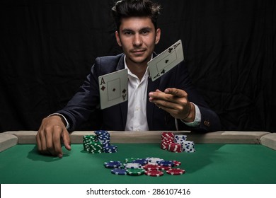 Player At The Poker Table.