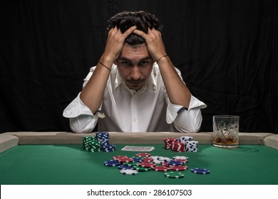 Player At The Poker Table.