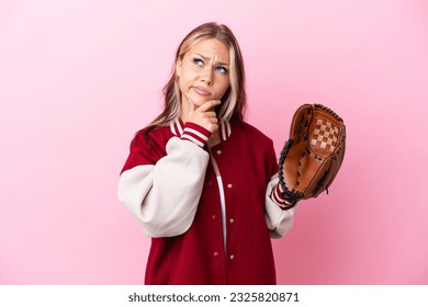 Player Russian woman with baseball glove isolated on pink background having doubts - Powered by Shutterstock