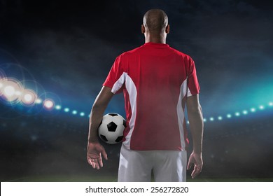 Player with a soccer ball on the field, rear view - Powered by Shutterstock