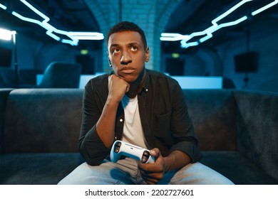 The player is waiting for the game to start on the console. Pause in the game. High quality photo - Shutterstock ID 2202727601