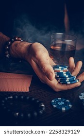 The player watches art while playing poker. A combination of four aces, four of a kind, winning cards fell out - Shutterstock ID 2258329129
