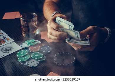 The player watches art while playing poker. A combination of four aces, four of a kind, winning cards fell out - Shutterstock ID 2258329137