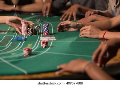 Player winning chip with betting baccarat with banker hand