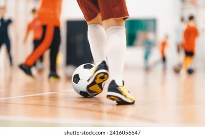 Players in Futsal Training. Indoor Soccer Class for Kids at School Sports Hall. Children Kicking Soccer Balls on Wooden Futsal Floor  - Powered by Shutterstock