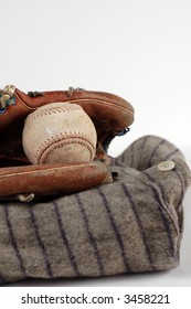 A Player's Old Uniform And Baseball Gear.