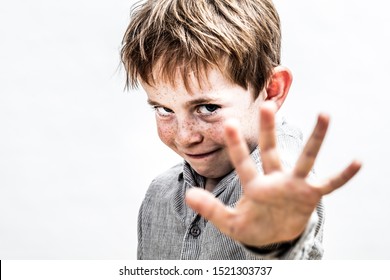 Playful Boy Standing For Defense Of Child Boundaries With His Hand Forward, Determined For Stopping Abuse, White Background, Contrast Effect