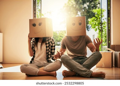 Playful, couple and cardboard with boxes on head for moving day, comedy renovation and property investment. People, funny drawing and new house with future security, comic celebration and emoji game - Powered by Shutterstock