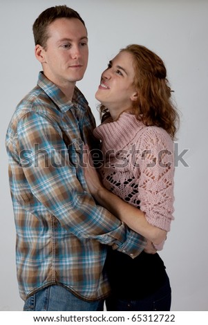 Similar – Image, Stock Photo Studio portrait of a young couple hugging