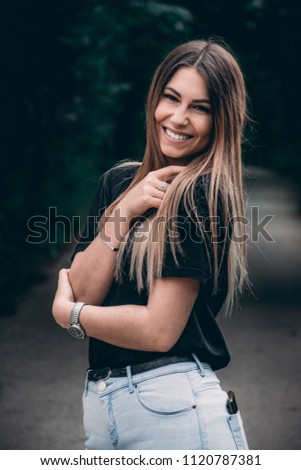 Similar – Blonde young caucasian woman smiling on steps