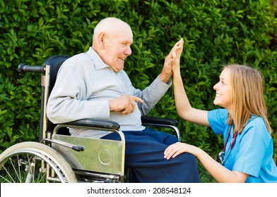 Playful doctor with patient at the nursing home.