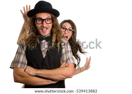 Playful engaged couple quirky fashion having fun playing positive humorous friends