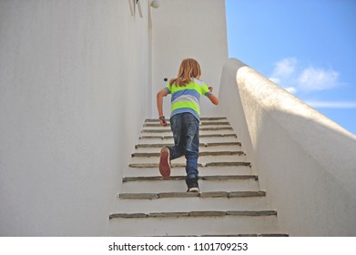 Playful Kid Going Up The Stairs