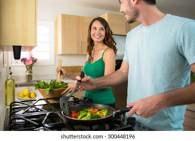 Playful Lifestyle Cooking At Home Man And Woman Flirting And In Love 