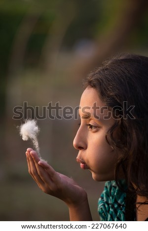 Similar – Image, Stock Photo Girl plucks off a piece of cotton candy