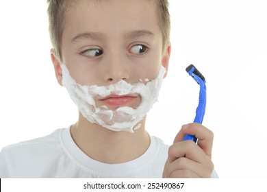 Playful Little Young Boy Shaving Face Over White Background