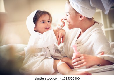 Playful with mommy after bath. Little girl.  - Powered by Shutterstock