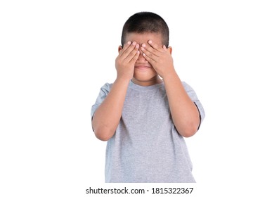 Playful Shy Asian Boy Covering His Face And Smiling ,isolated On White Background.
