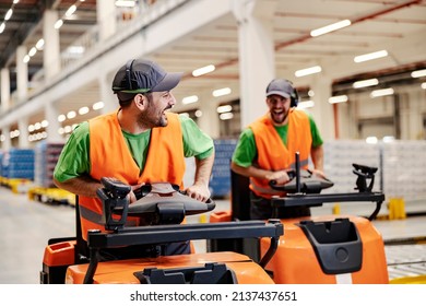 Playful Storage Workers Racing With Forklifts And Having Fun At Work.