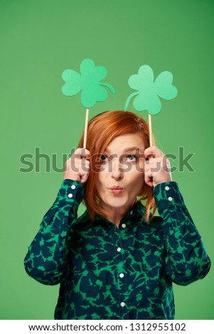 Playful woman celebrating Saint Patrick's Day