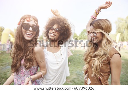 Playful young girls at summer festival