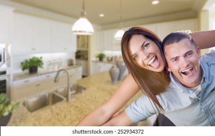 Playful Young Military Couple Inside Home With Beautiful Custom Kitchen.