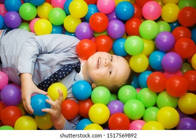Playground with ball pit indoor. Children playing with colorful balls in playground ball pool. Holiday or birthday - Shutterstock ID 1517569892