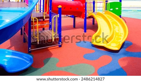 Playground Floor Modern Background, Pattern Architecture Design of Colorful Safety Rubber Floor with Slide and Playground Equipment at Kindergarten School