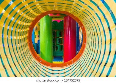 Playground Indoor, Inside View Of Kids Jungle In Play Room, Round Tunnel In Children's Gym. Plastic Playroom With Slide And Maze, Sport Ground Indoors.